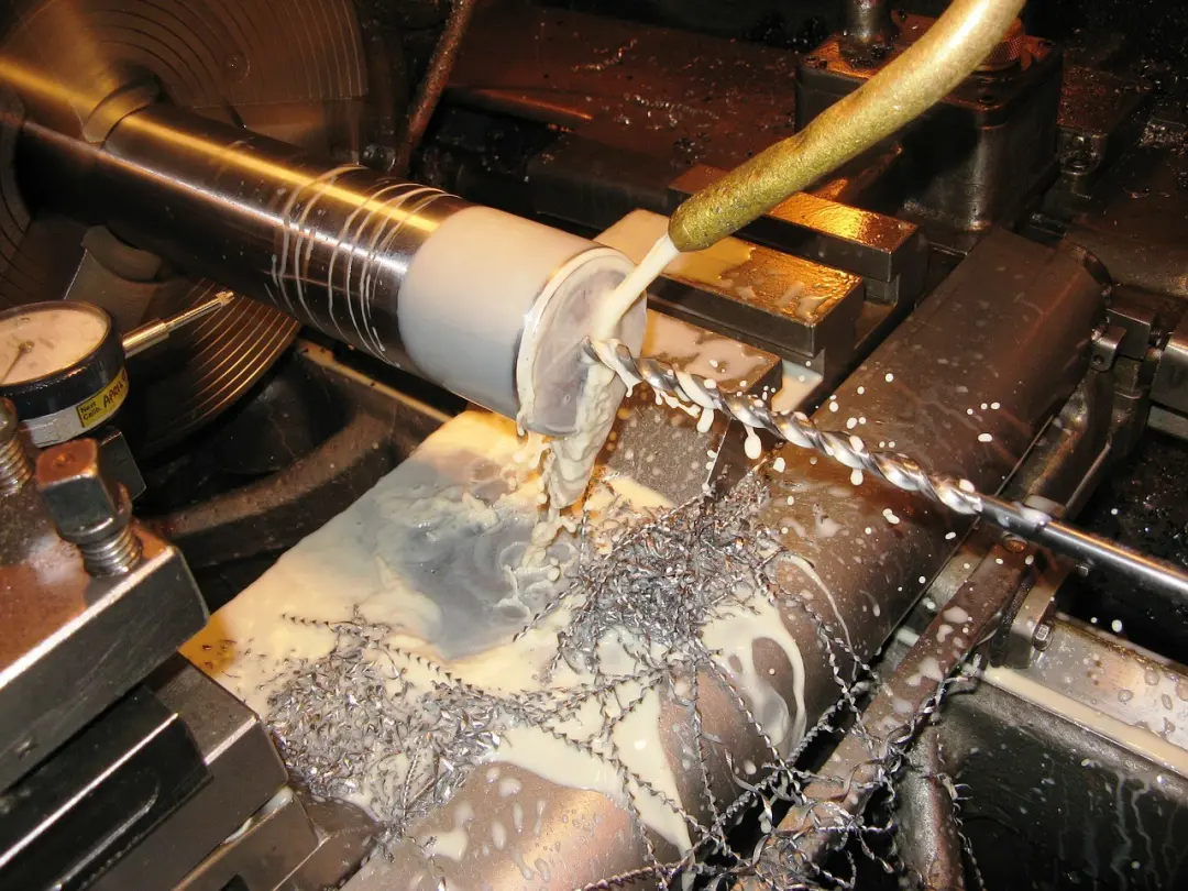 Drilling through a steel section in the workshop