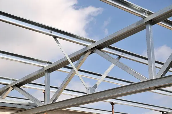 Galvanised steel roof frame against the sky